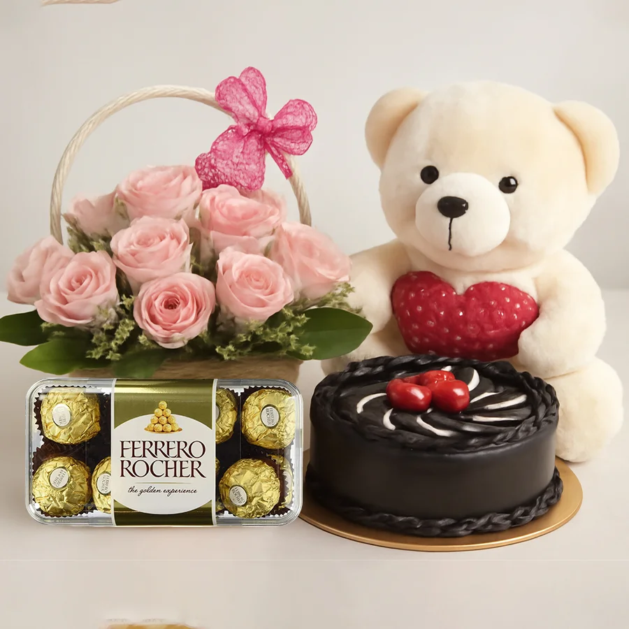Charming pink roses basket with chocolate cake, teddy, and Ferrero Rocher chocolates.
