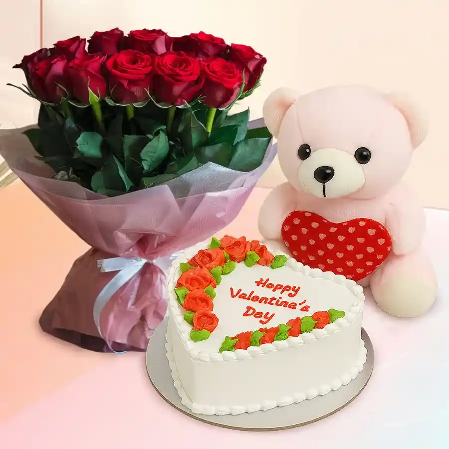 Heartfelt gift set featuring 12 red roses, a heart-shaped pineapple cake, and a pink teddy bear.