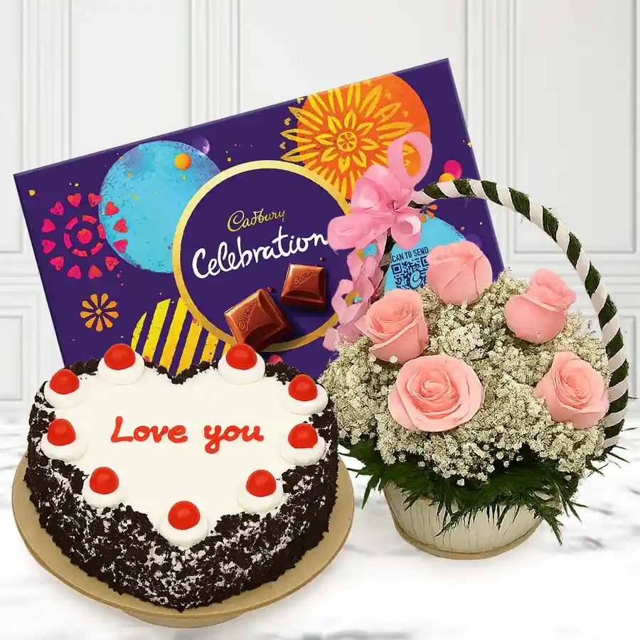 Enchanted gift featuring pink roses, a Black Forest cake, and Cadbury chocolates in a beautiful arrangement.