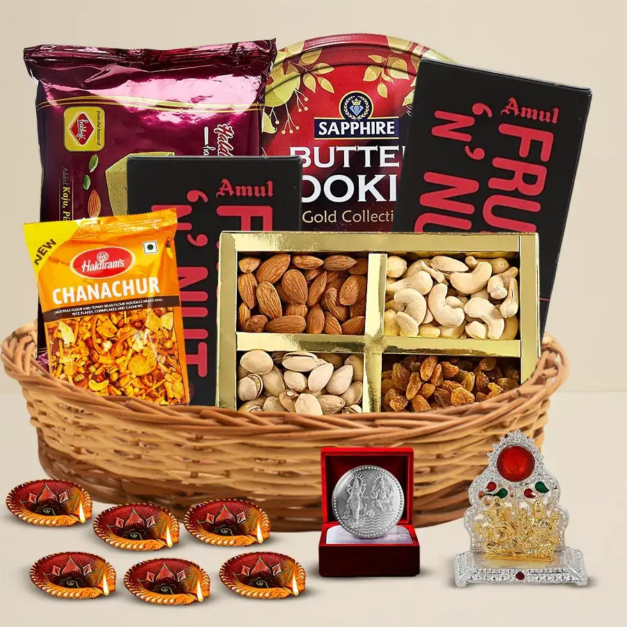 Diwali Celebration Gift Hamper Extravaganza featuring cookies, dry fruits, chocolates, Ganesh Laxmi Mandap, and decorative Diyas.