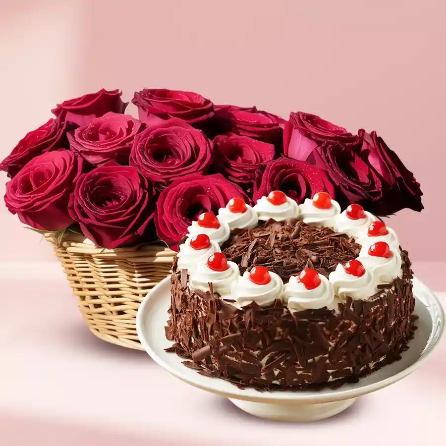 Delightful combo of 12 red roses in a basket and a 1/2kg eggless Black Forest cake.