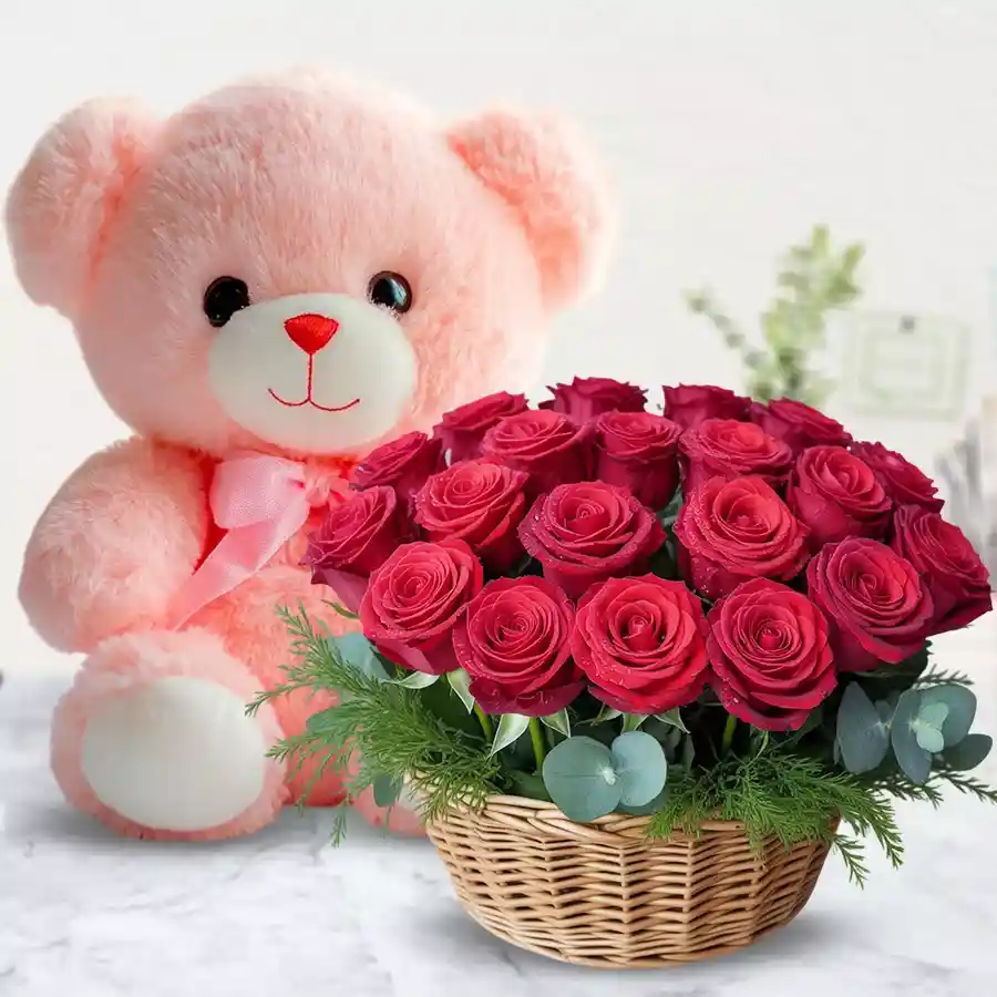 A lovely basket of red roses with a cute pink teddy bear, symbolizing love and affection.