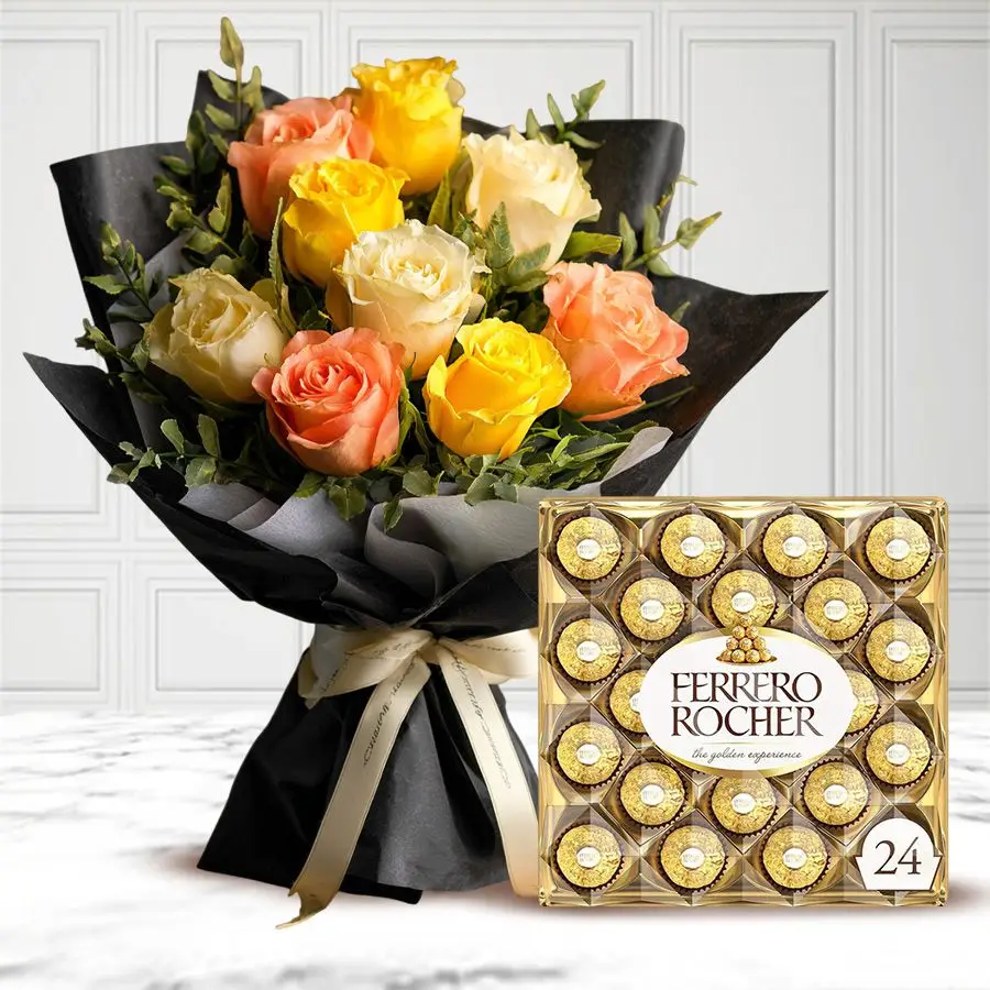 A charming bouquet of peach and yellow roses with a box of Ferrero Rocher chocolates.