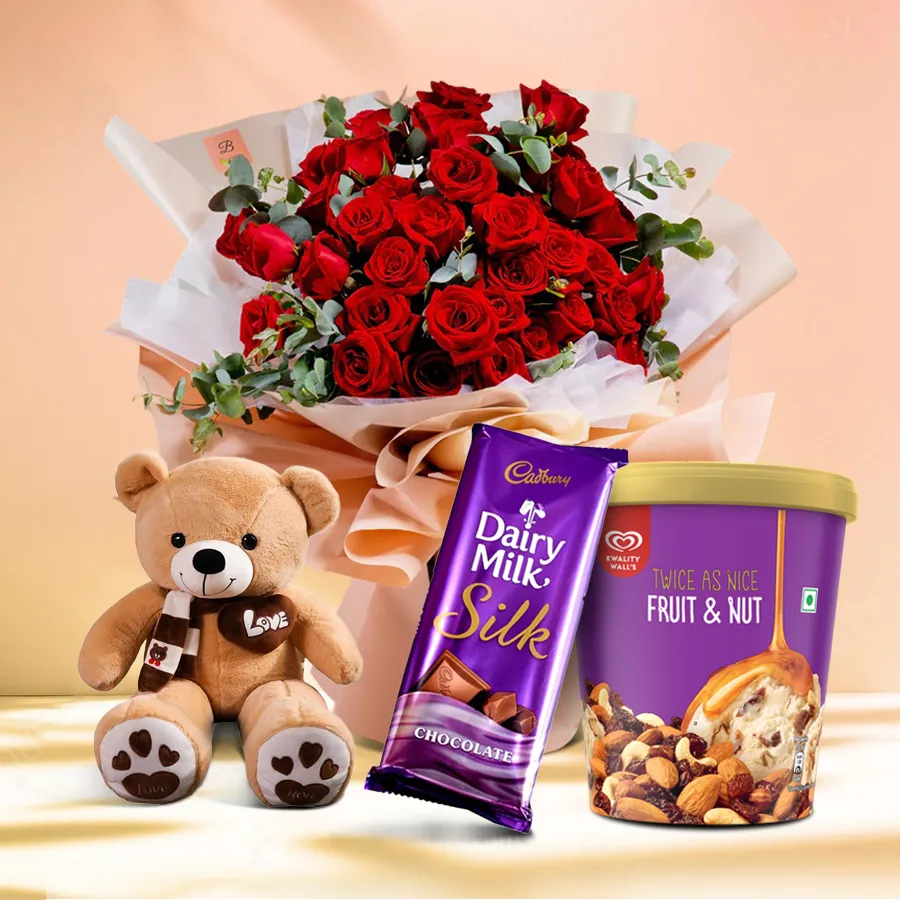 Captivating Red Roses Bouquet with ice cream and teddy bear.