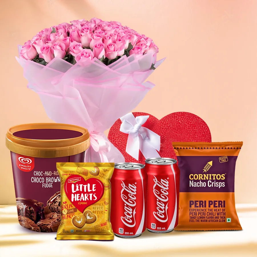 A vibrant gift hamper featuring pink roses, Kwality Walls ice cream, cookies, nachos, Coca-Cola, and handmade chocolates. Perfect for celebrations.