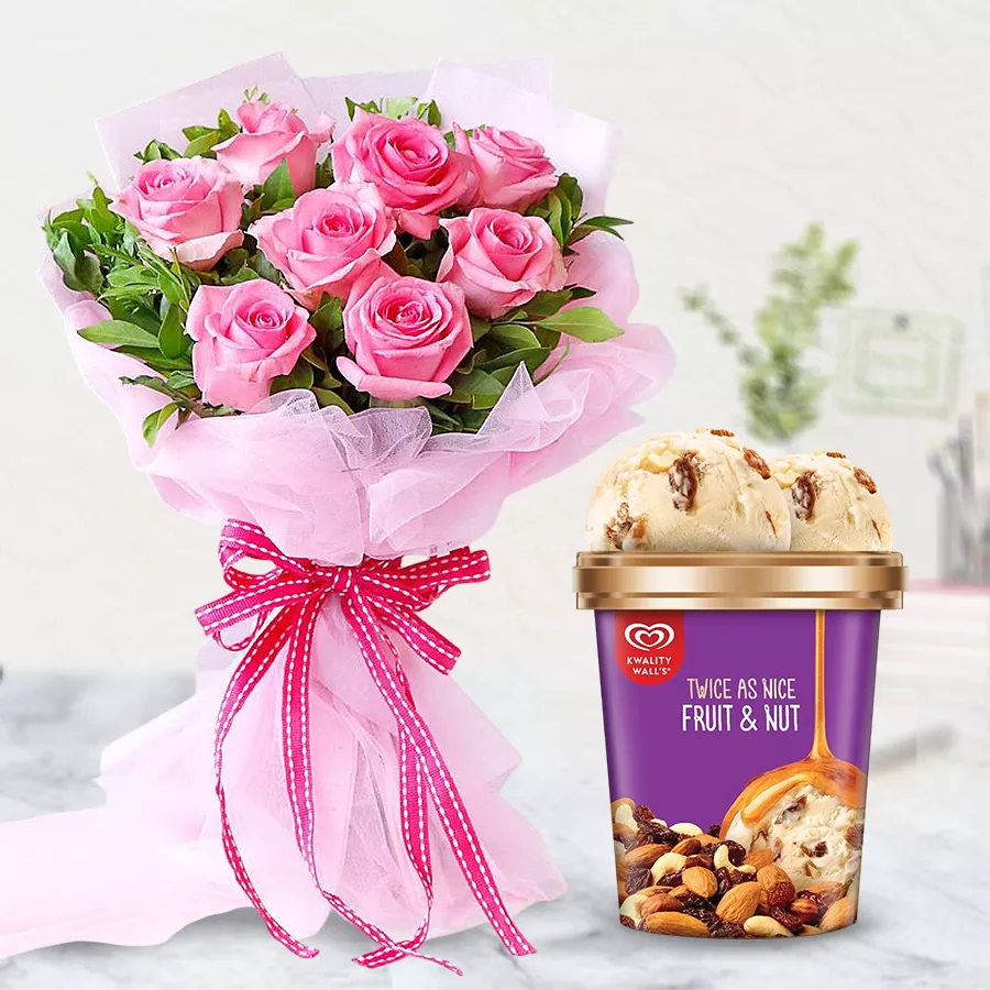 A vibrant bouquet of pink roses paired with Kwality Walls Fruit n Nut Ice-Cream.