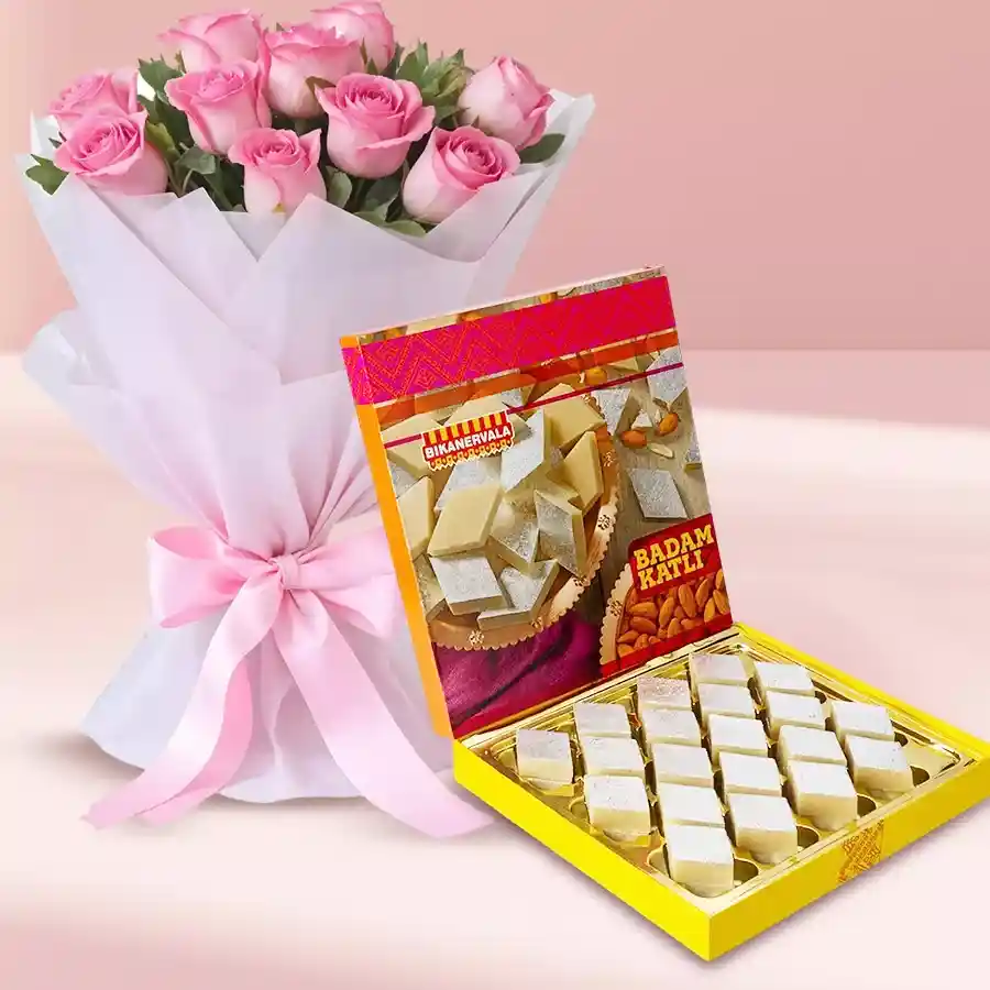 500 grams of Bikanervalas Badam Katli accompanied by a bouquet of ten pink roses, perfect for heartfelt gifting in Ahmedabad.