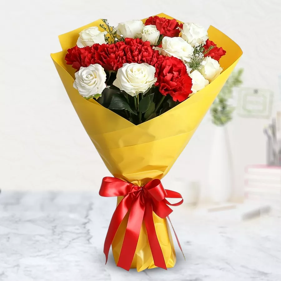 A stunning bouquet featuring vibrant roses and lively carnations, perfect for gifting on any occasion.