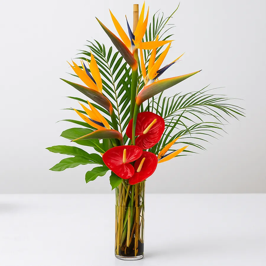 A vibrant floral arrangement featuring Birds of Paradise and red Anthuriums, perfect for celebrating love and special occasions.