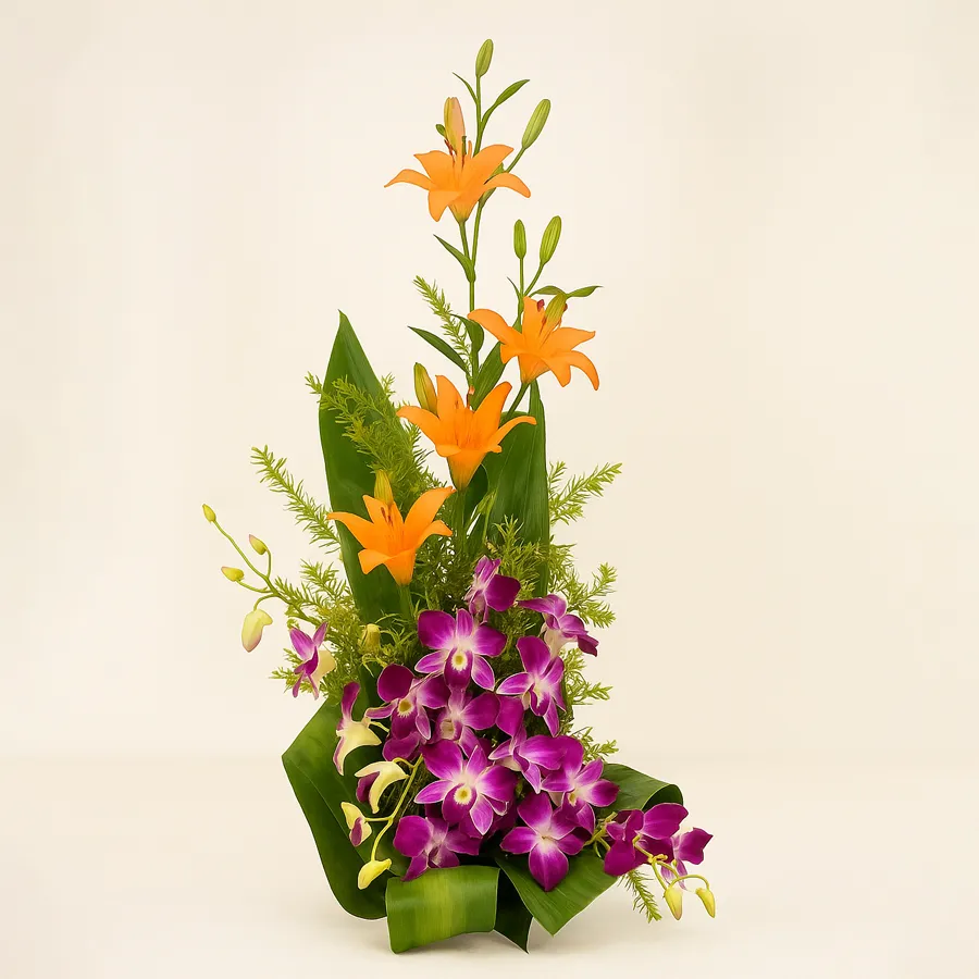 A vibrant floral arrangement featuring orange lilies and purple orchids, elegantly styled with golden stem decorations. Perfect for special occasions.