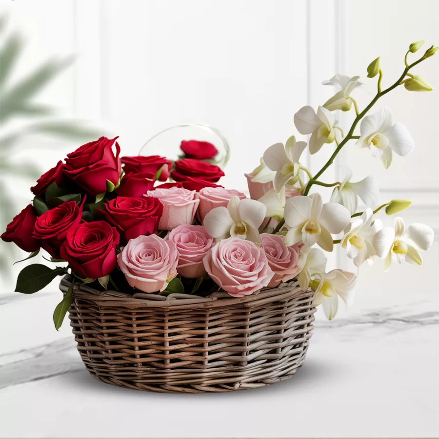 Dazzling Mixed Blooming Basket featuring red roses, pink roses, and white orchids, beautifully arranged in a basket.