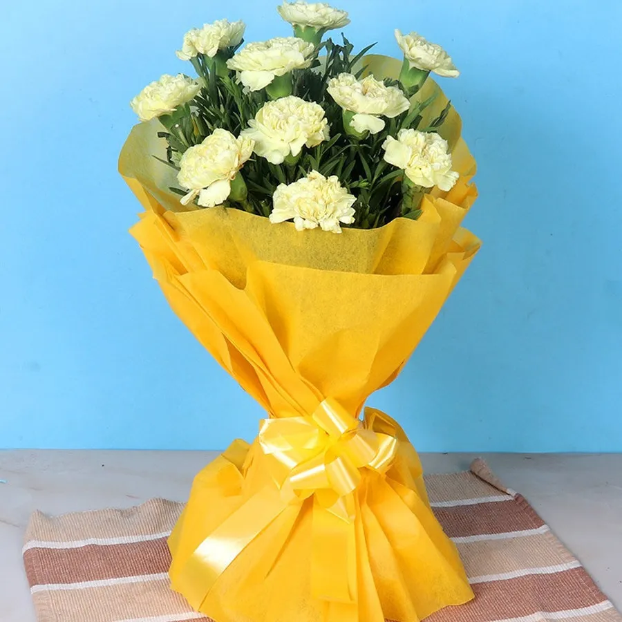 A vibrant bouquet of 12 yellow carnations symbolizing joy and affection.