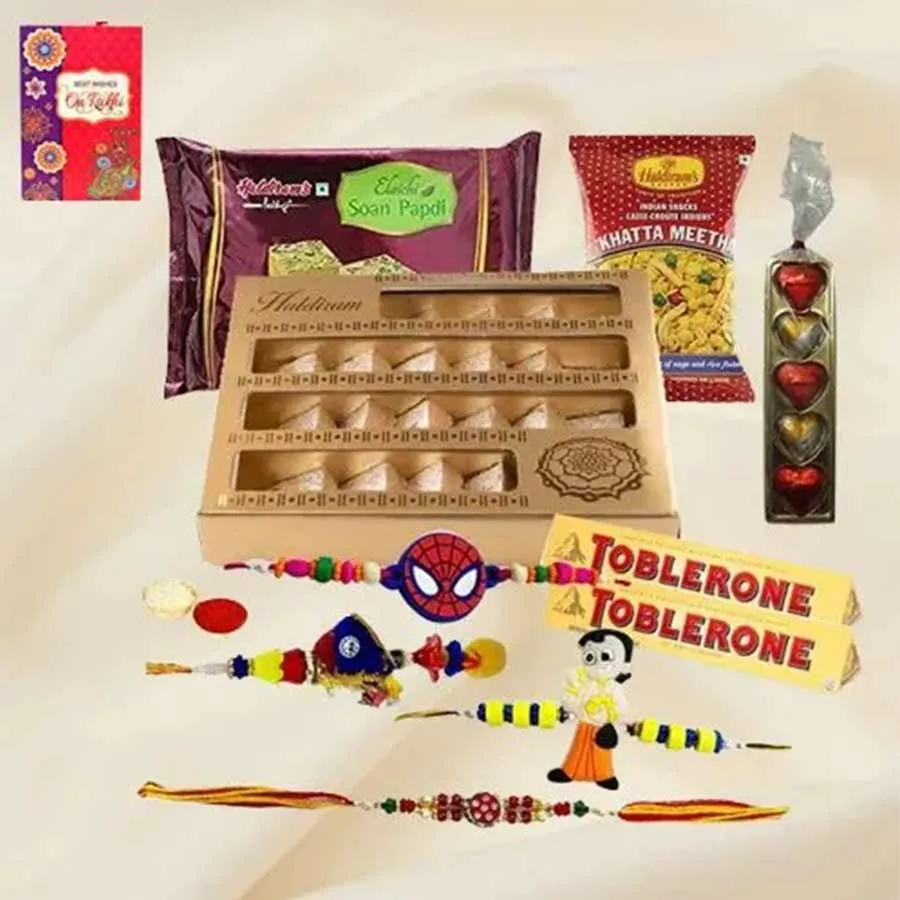 Wonder Collection from Haldiram featuring Soan Papdi, Kaju Katli, Khatta Meetha Mixture, Toblerone Chocolates, and homemade-style chocolates arranged in an attractive gift box
