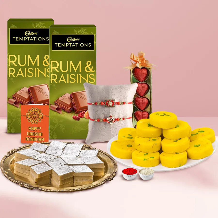 Delight of Bite Ensemble from Haldiram featuring Kaju Katli, Kesaria Peda, Cadbury Temptation Chocolate Bars, and homemade chocolates