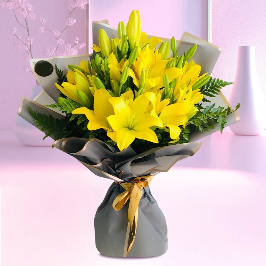 Bouquet of 5 vibrant yellow lilies ideal for anniversary gifting.