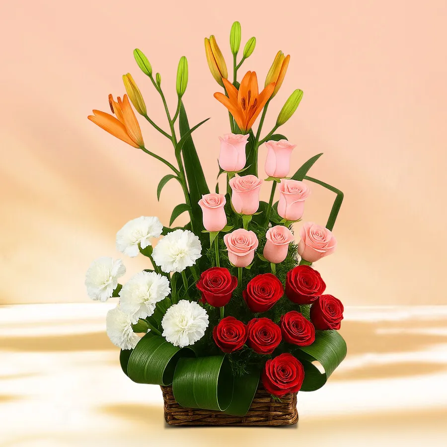 Assorted bouquet featuring red roses, pink roses, white carnations, and orange lilies, perfect for celebrations.