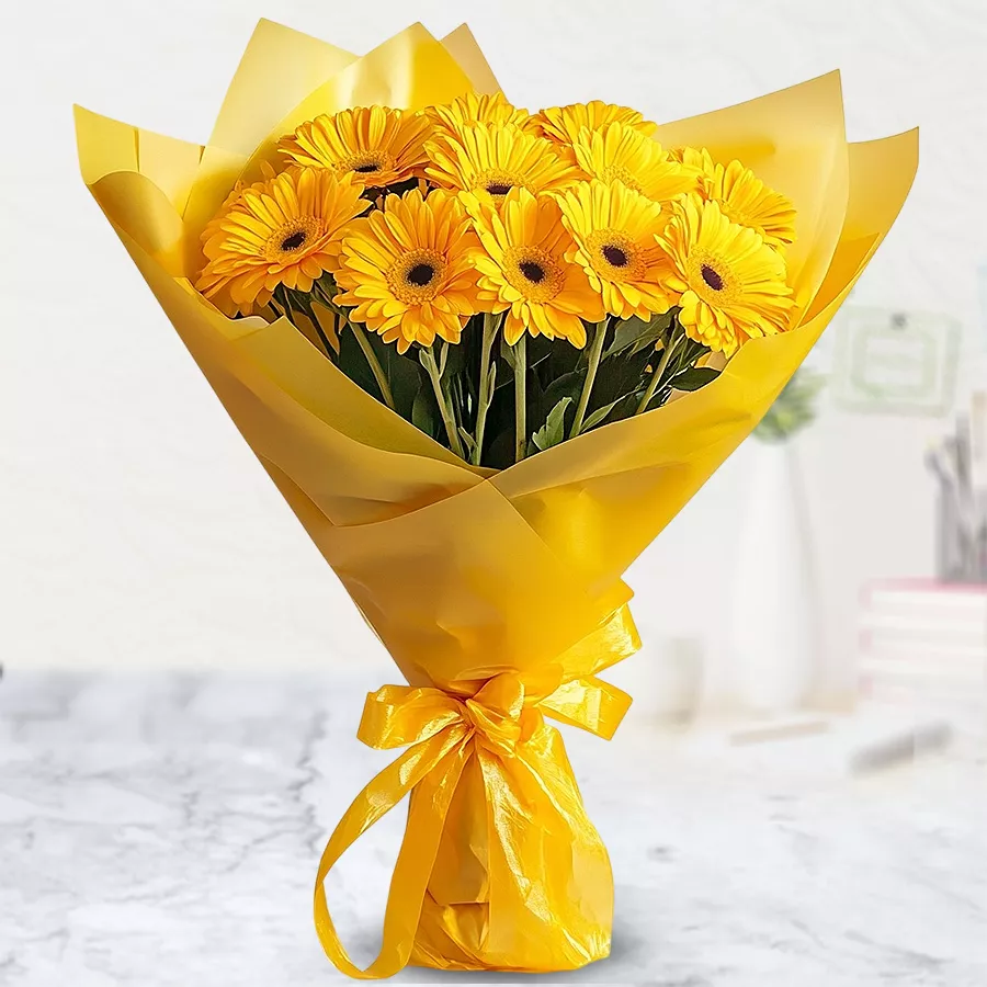 A vibrant bouquet featuring 10 bright yellow Gerberas, perfect for gifting and expressing heartfelt emotions.