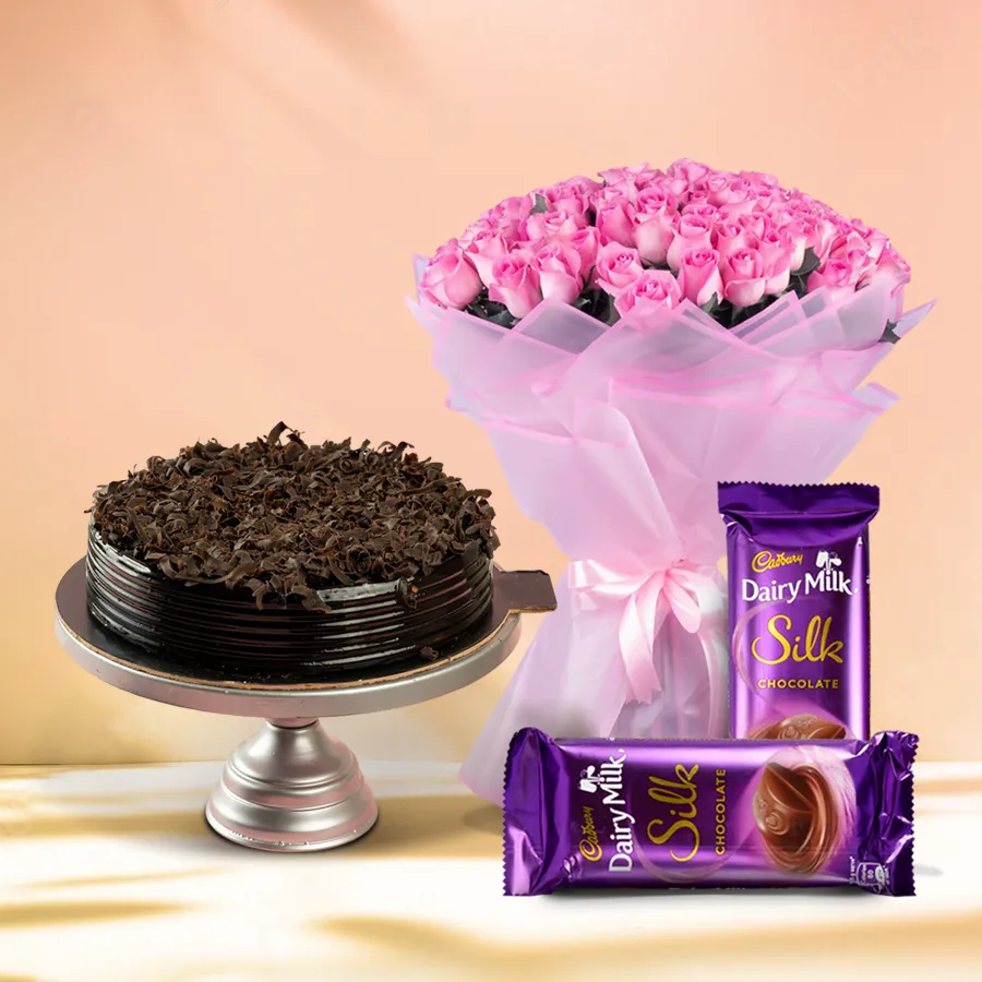 1 kg Chocolate Cake with pink rose bouquet and Cadbury chocolates.