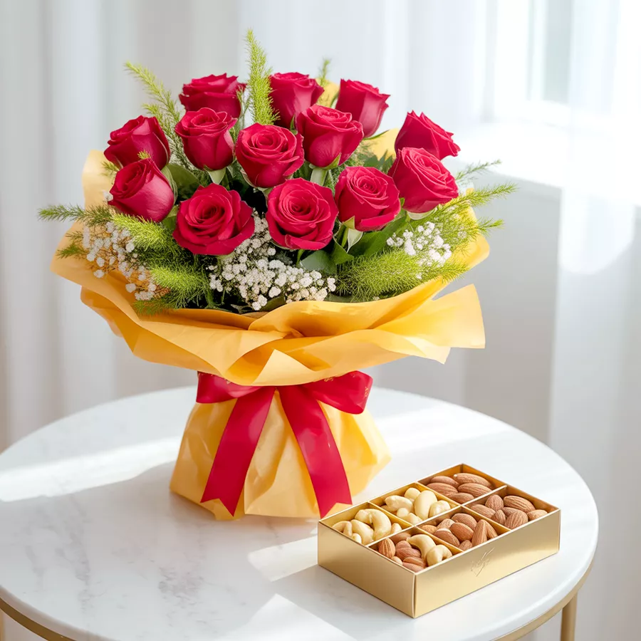 A luxurious gift set featuring assorted dry fruits and a bouquet of 12 red roses.