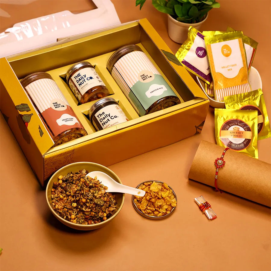 Delightful Gourmet Rakhi Snack Box filled with healthy snacks and a Rakhi.