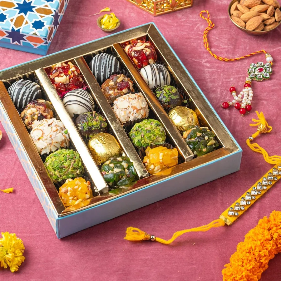Fusion Sweets and Rakhi Harmony gift box featuring Indian fusion sweets and two beautifully crafted Rakhis.