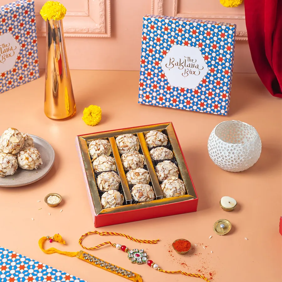 Almond Truffle and Rakhi Celebration Set featuring gourmet truffles and beautiful rakhis for a heartfelt gift experience.