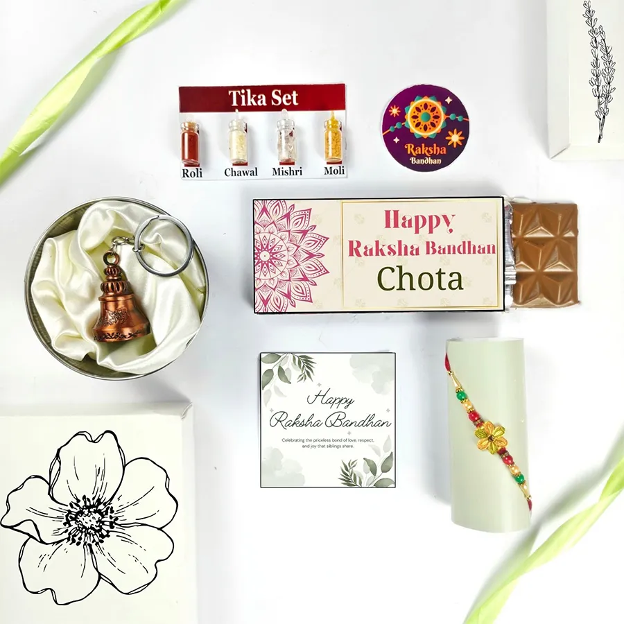Elegant Rakhi Celebration Gift for Raksha Bandhan with Rakhi, chocolate, bell, greeting card, and Tika Set.