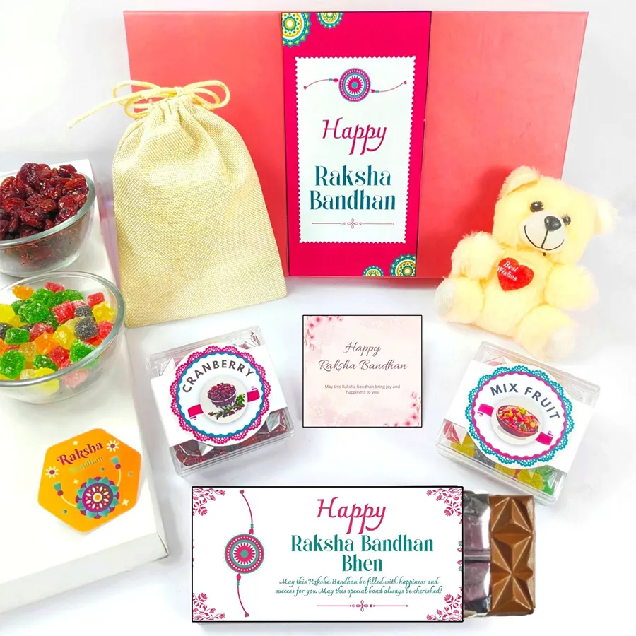 Delightful Rakhi Treat Box Surprise featuring a teddy, chocolate, mix fruits, dried cranberries, and a greeting card, beautifully packaged for Raksha Bandhan.