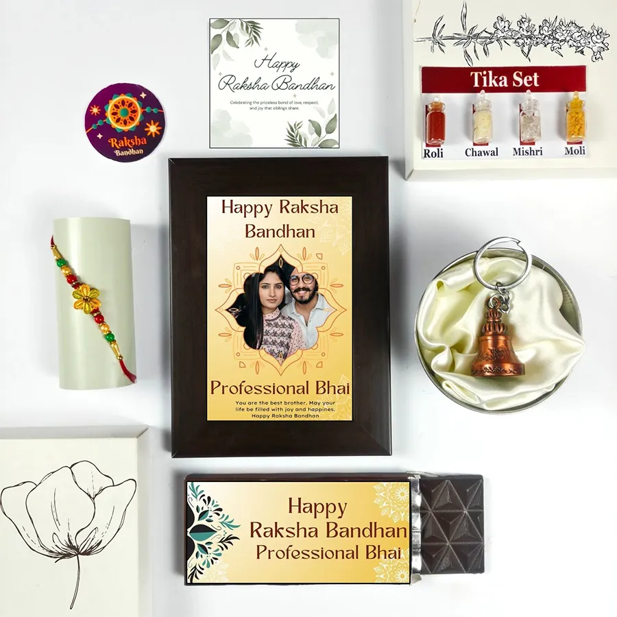 Cherished Rakhi Memory Package featuring Rakhi, chocolate, photo frame, greeting card, guardian bell, and tika set for a special celebration.