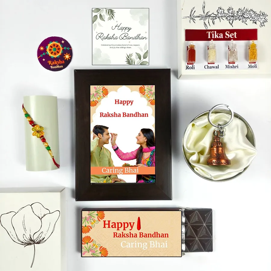 Sibling Love Rakhi Gift Set with chocolate bar, photo frame, Rakhi, Tika set, guardian bell, and greeting card for Raksha Bandhan.