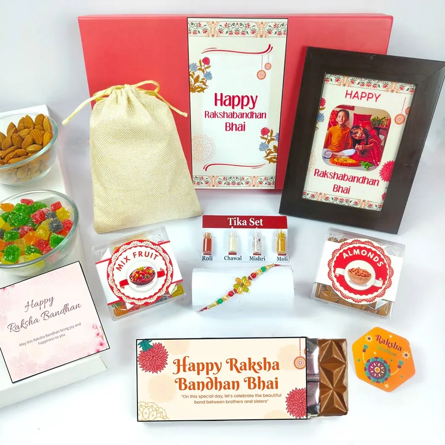 Cherished Rakhi Celebration Gift Set with chocolates, a personalized photo frame, jute potli, fruits, almonds, and a greeting card for Raksha Bandhan.