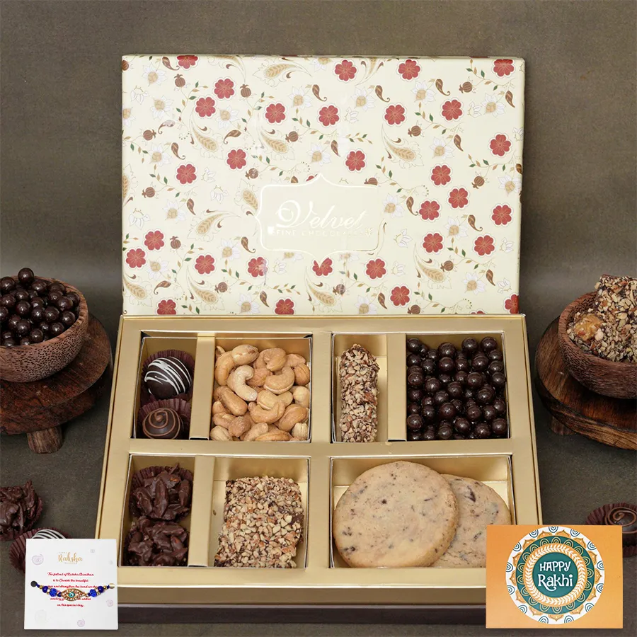 Divine Indulgence Rakhi Treat Box with Evil Eye Rakhi, truffles, snacks, and greetings card.