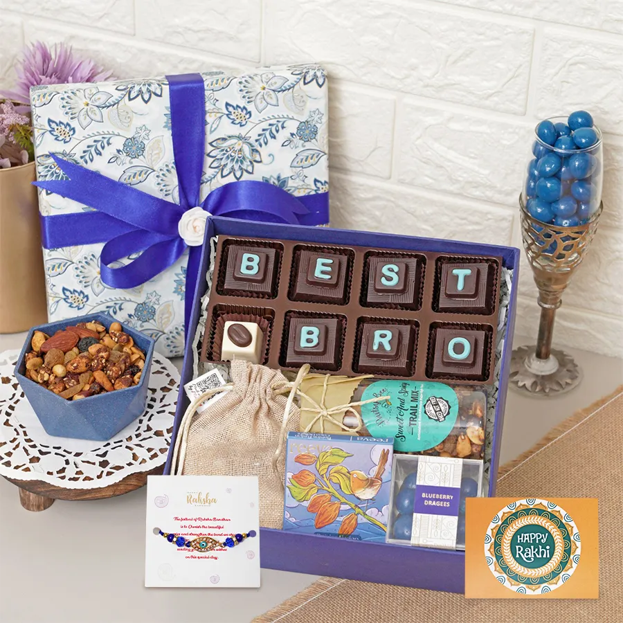 Joyful Rakhi gift set featuring assorted chocolates, almond rocks, trail mix, blueberry dragees, coco delight bar, and a Rakhi with card.