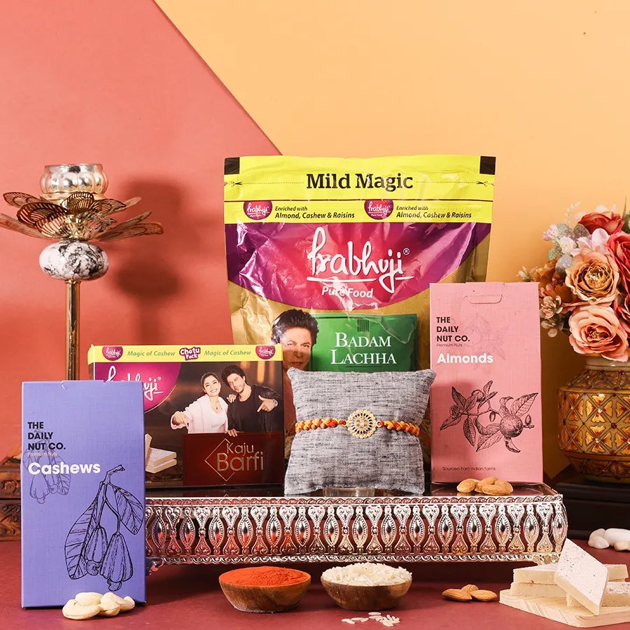Rakhi Joy with Festive Goodies Combo featuring rakhi, cashews, almonds, and sweets for Raksha Bandhan.