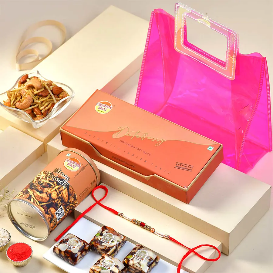 Premium Rakhi Treats Hamper featuring a decorative Rakhi, Dateberry, Mewa Dalmoth, and a beautiful gift bag for Raksha Bandhan.