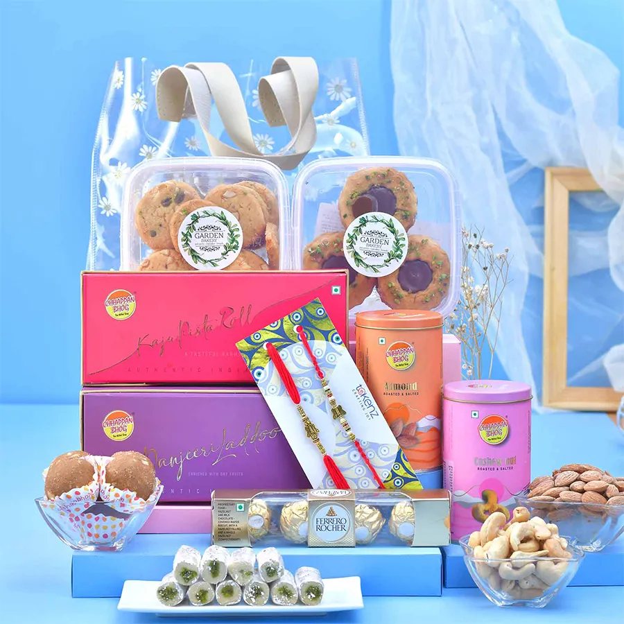 Sweetness & Bond: Rakhi Delight Pack gift featuring Rakhis and gourmet treats in a floral print gift bag.