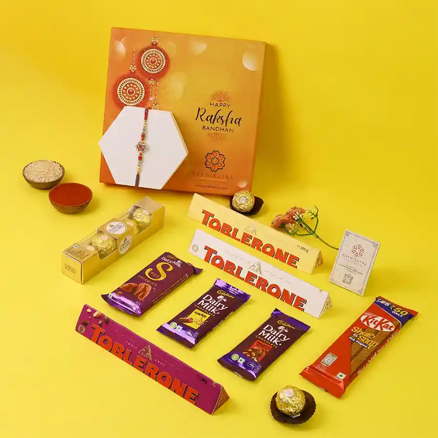 Swastik Rakhi accompanied by a variety of chocolates in a beautiful box.