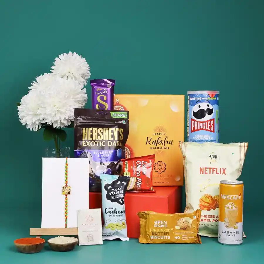 Elegant Rakhi gift box filled with gourmet snacks