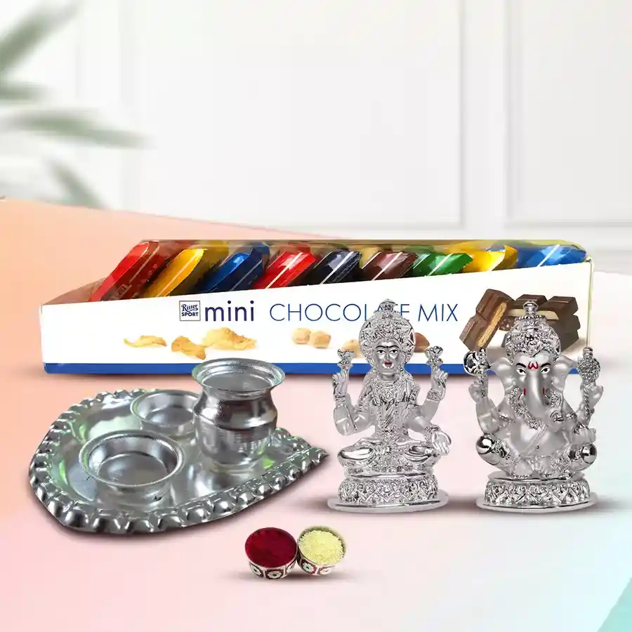 Exclusive Choco Assortments Combo Gift featuring Ritter Sport Mini Chocolates, a silver-plated Ganesh Laxmi idol, and a decorative paan-shaped pooja thali with complimentary roli, tika, and chawal