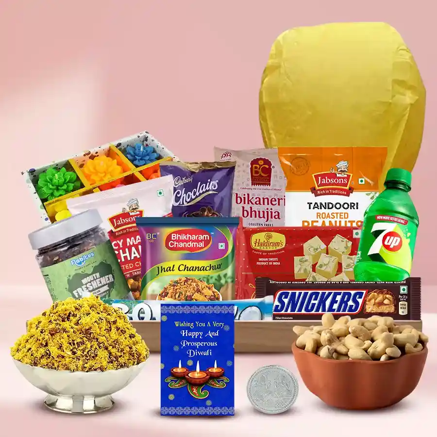 Delightful Assortment Gift Basket for Diwali featuring imported chocolates, snacks, a flying lantern, wax diyas, reusable tray, silver Ganesh Lakshmi coin, and a Diwali greetings card.