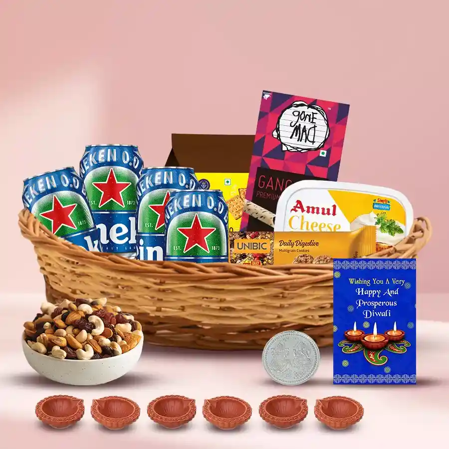 Wonderful Goodies Gift Hamper for Diwali featuring delicious treats, decorative mud diyas, and a free silver-plated Laxmi Ganesh coin in a stylish reusable cane basket.