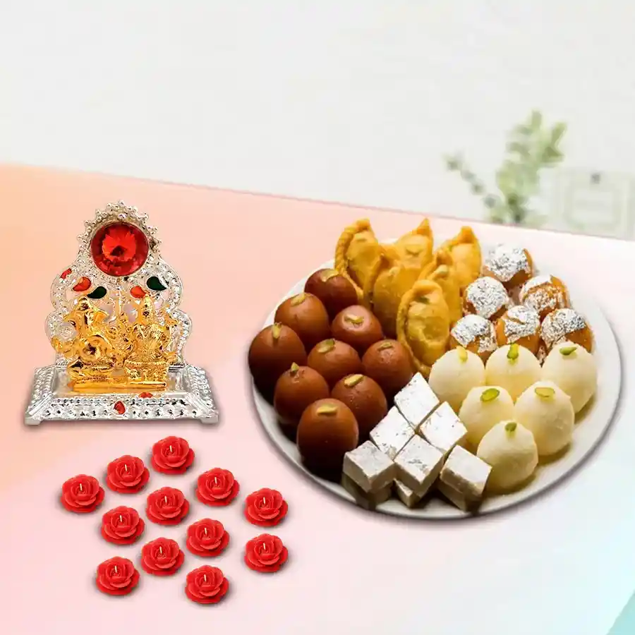 Exclusive Diwali sweets assortment with antique Laxmi Ganesh Mandap and decorative wax candles