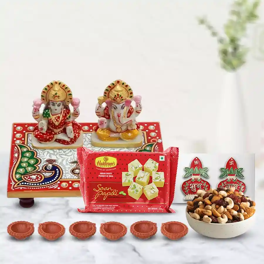 Auspicious Diwali Pooja Special Combo featuring a Laxmi Ganesh Marble Chowki, six decorative diyas, Subh Labh Wall Stickers, Haldiram Soan Papdi, and assorted dry fruits.