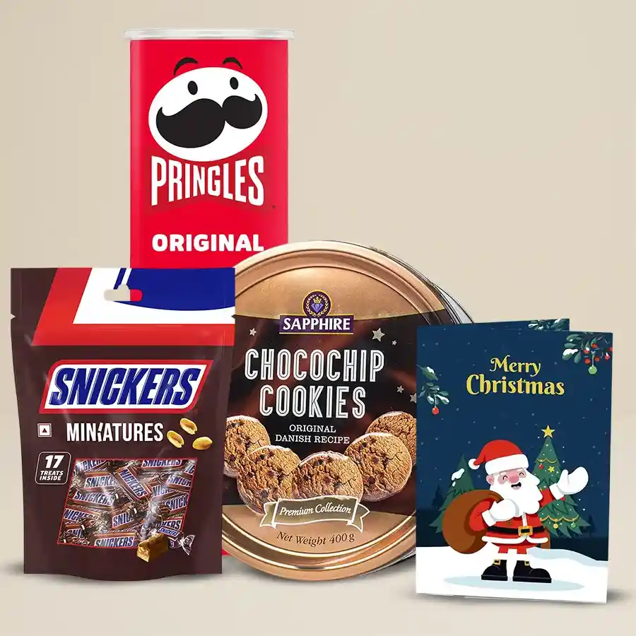 Remarkable Goodies Gift Combo featuring Sapphire Chocochip Cookies, BBQ Pringles Chips, Snickers Miniature Chocolates, and a festive X-Mas Greetings Card.