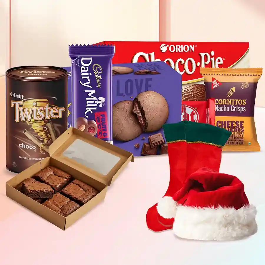 Christmas gift hamper filled with chocolates, snacks, Santa hat, and stockings