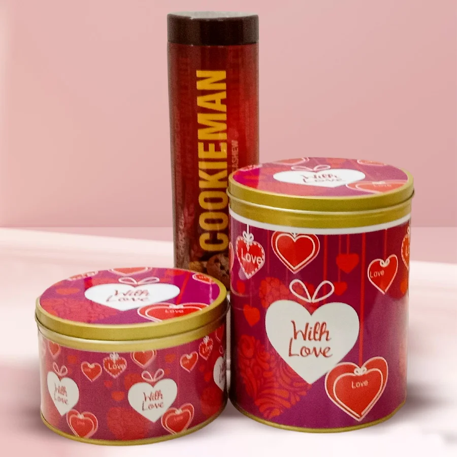 Mouth-watering imported cookies and chocolates combo in a stylish tin, featuring almond cookies, chocochip and sesame cookies, and handmade chocolates.