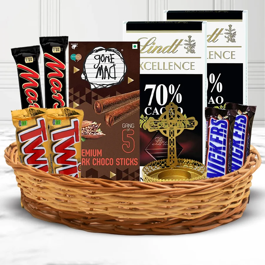 Amusing Chocolates Gift Hamper featuring an assortment of chocolate bars, flower-shaped wax candles, and a stylish candle stand arranged in a charming basket.