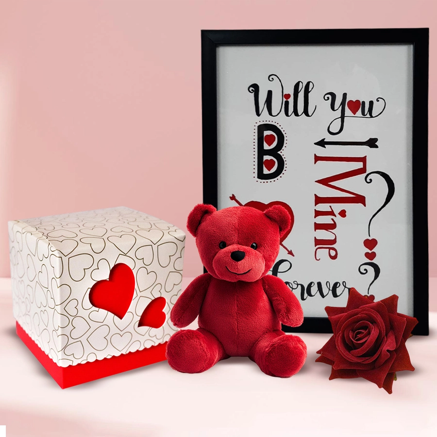 Handcrafted frame with chocolates, a teddy bear, and red roses for Promise Day gift.