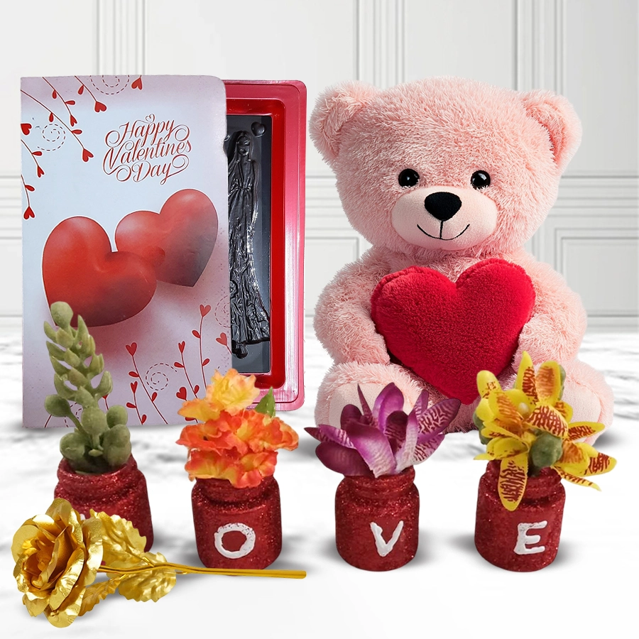 Magnificent Love Gift Combo featuring a Teddy bear with a heart, a Handmade LOVE Décor Bottle, Love Book Chocolates, and an elegant Golden Rose