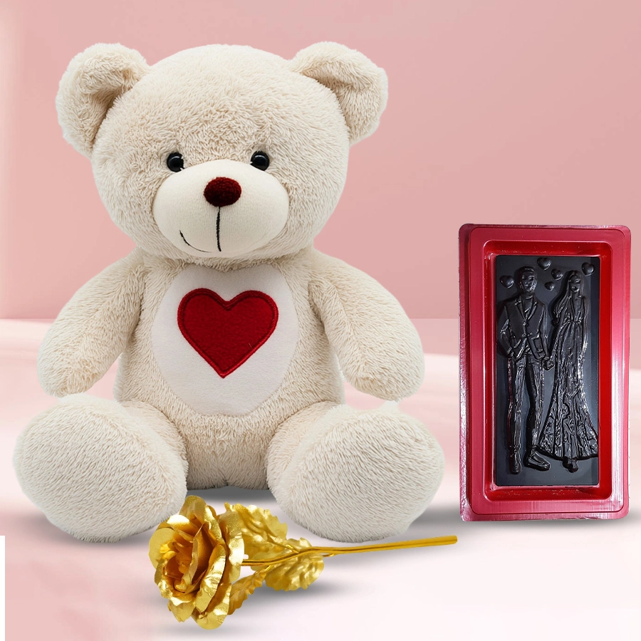 Cuddly heart teddy bear with chocolates and a golden rose for Valentine's Day gift.